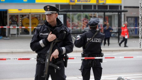 Police cordon off the area around the Hamburg supermarket where the attack occurred Friday.  