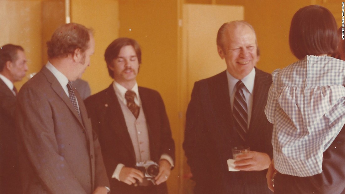 President Gerald Ford, right, visited the US Beijing Liaison Office in 1976. Booth, seen here holding a camera, was responsible for assisting the Secret Service with Ford&#39;s security on the ground. &quot;My role was guaranteeing that no one came into his immediate area uninvited,&quot; Booth remarked. Booth&#39;s lapel pin acted as a secret signal to his fellow Secret Service special agents and White House staff that he was armed. &quot;I probably have my Smith and Wesson  Model 19 .357 magnum attached to my belt,&quot; he explained. 