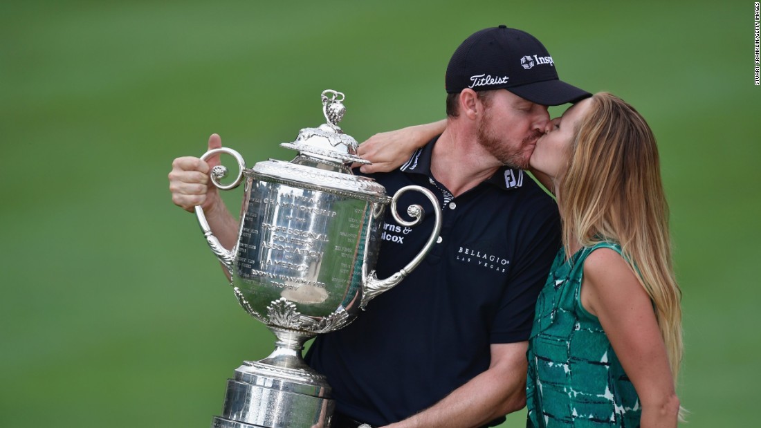 Erin Walker kisses husband Jimmy Walker after he claimed the US PGA Championship in 2016. She spends 30 weeks of the year traveling the world as he participates on the PGA Tour.