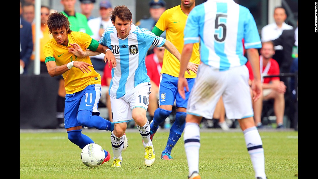 Neymar battles Argentina&#39;s Lionel Messi during an international friendly in June 2012. The two would later become teammates at Barcelona.