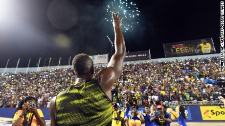 Usain Bolt of Jamaica salutes the crowd after winning 100m &quot;Salute to a Legend &quot; race during the Racers Grand Prix at the national stadium in Kingston