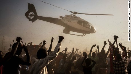 Supporters of Kenyan presidential candidate Raila Odinga wave as he departs in a helicopter after addressing a rally held by his coalition party The National Super Alliance (NASA) in Kisumu on August 3, 2017. 
Raila Odinga, Kenya&#39;s veteran opposition leader and one-time prime minister, is taking his fourth run at the presidency in an election next week. The 72-year-old has been a mainstay of Kenyan politics since the 1980s but has never achieved his presidential ambition, his career emulating that of his father, Jaramogi Oginga Odinga, who led the opposition for three decades but never the country. / AFP PHOTO / FREDRIK LERNERYD        (Photo credit should read FREDRIK LERNERYD/AFP/Getty Images)