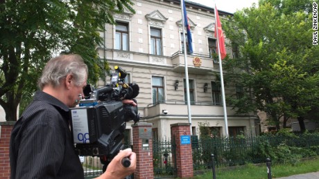 A  cameraman stands in front of the Vietnamese Embassy in Berlin on August 2.