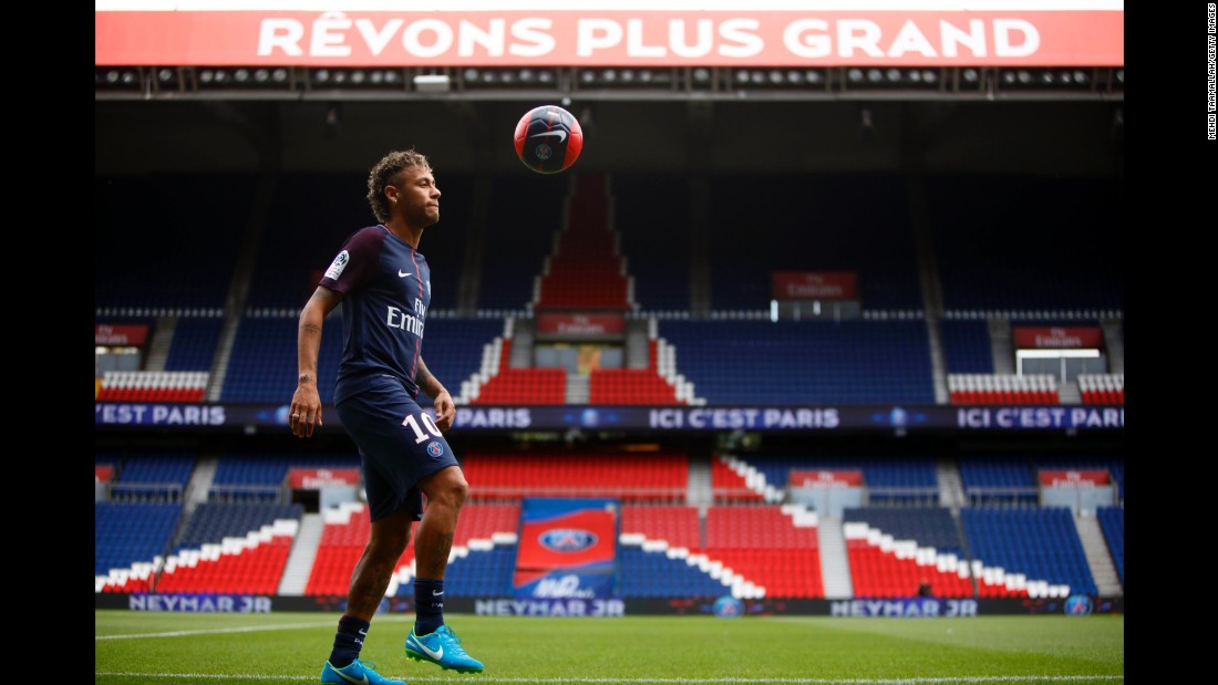 Neymar juggles a ball Friday, August 4, after he was unveiled to the media as Paris Saint-Germain&#39;s newest signing. His transfer fee was more than double the previous world record.