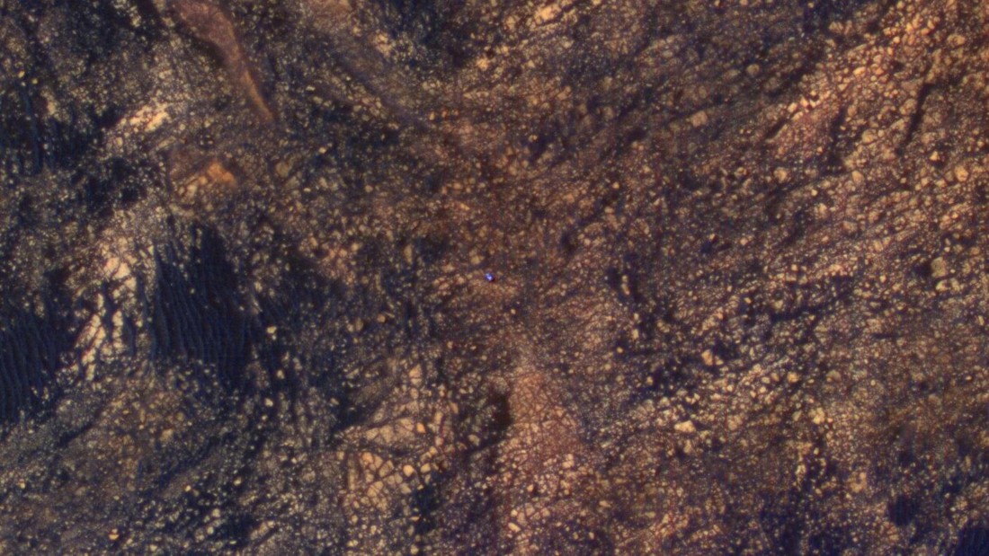 The bright blue speck in the middle of this image is NASA&#39;s Curiosity Mars rover. The image was taken from another NASA spacecraft, Mars Reconnaissance Orbiter, which is in orbit above the planet, on June 6, 2017.