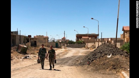 The front line still divides Quneitra, but there is virtually no fighting at the moment, the regime says. Soldiers are relaxed as they go to their battle positions. 