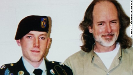 This photo of Nathan Nicholson and his father, Jim Nicholson, was taken during Christmas season of 2003 prior to Nathan&#39;s promotion to private first class and prior to his career-ending accident.