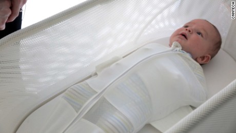 newborn sleeping in crib