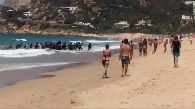 Migrant boat lands on Spanish beach