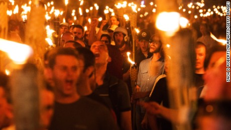 White nationalists and others march Friday night through the University of Virginia campus.