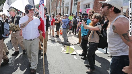 Hundreds of White nationalists, neo-Nazis and members of the &quot;alt-right&quot; are confronted by protesters  during the &quot;United the Right&quot; rally August 12, 2017, in Charlottesville, Virginia. 
