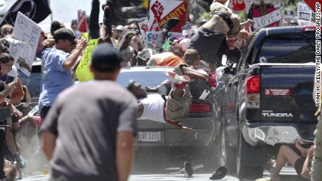 A car plows into counterprotesters marching against white nationalists Saturday in Charlottesville. 