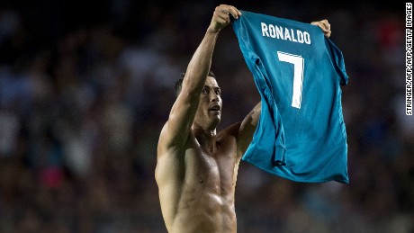 Ronaldo, as Messi did a few weeks ago, raises his shirt to the crowd after scoring.