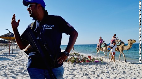 Armed police patrol Marhaba beach in Sousse in the aftermath of an ISIS attack that killed 38 people. 