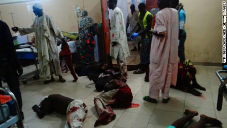 Injured victims of a female suicide bomber lie on the floor awaiting medical attention at a Maiduguri hospital in northeastern Nigeria on August 15, 2017.