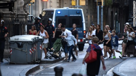 People fleeing the scene in Barcelona on Thursday after the attack.