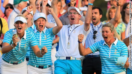 Catriona Matthew (second from left) celebrates Solheim Cup victory in 2013 with her husband and caddy Graeme Matthew.