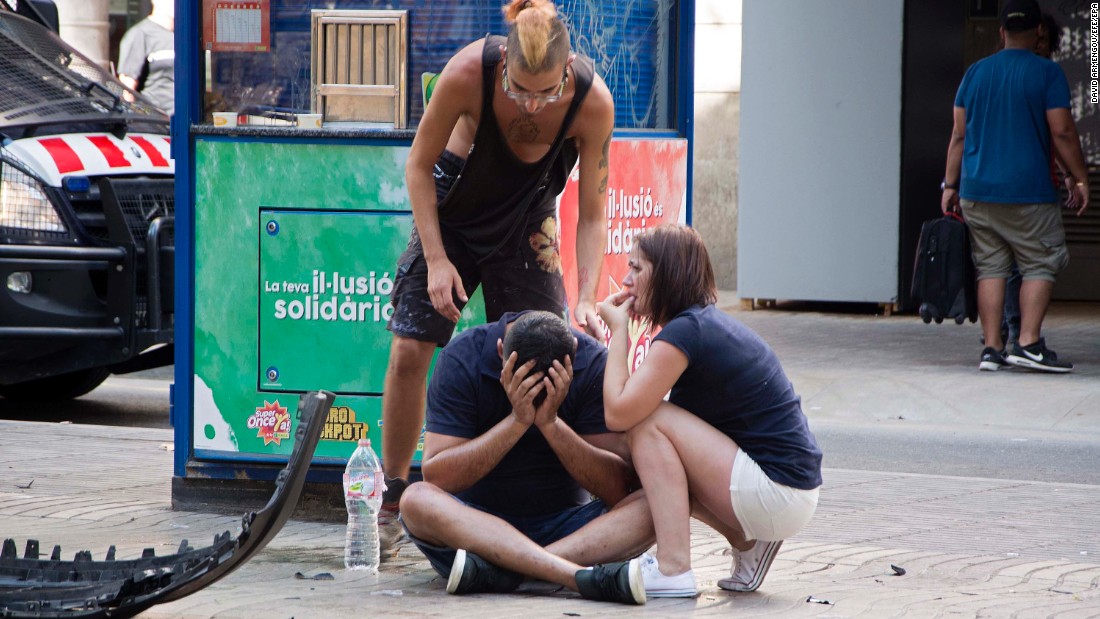 People react after the incident in Barcelona.