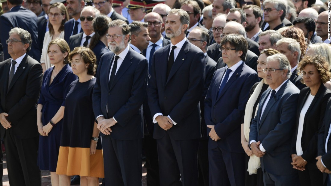 Spain&#39;s King Felipe VI joins other officials in observing a minute of silence in Barcelona&#39;s Plaça de Catalunya.
