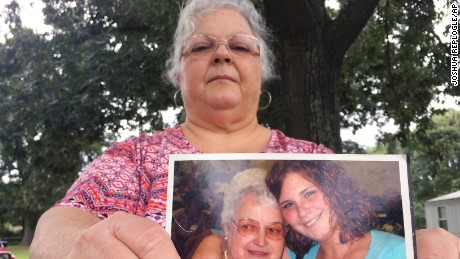 Susan Bro, the mother of Heather Heyer, holds a photo of Bro&#39;s mother and her daughter, Monday, Aug. 14, 2017, in Charlottesville, Va. Heyer was killed Saturday, Aug. 12, 2017, when police say a man plowed his car into a group of demonstrators protesting the white nationalist rally. Bro said that she is going to bare her soul to fight for the cause that her daughter died for. 