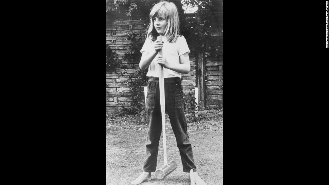 A barefoot Diana poses with a croquet mallet while on holiday in Itchenor, West Sussex, in the summer of 1970. 