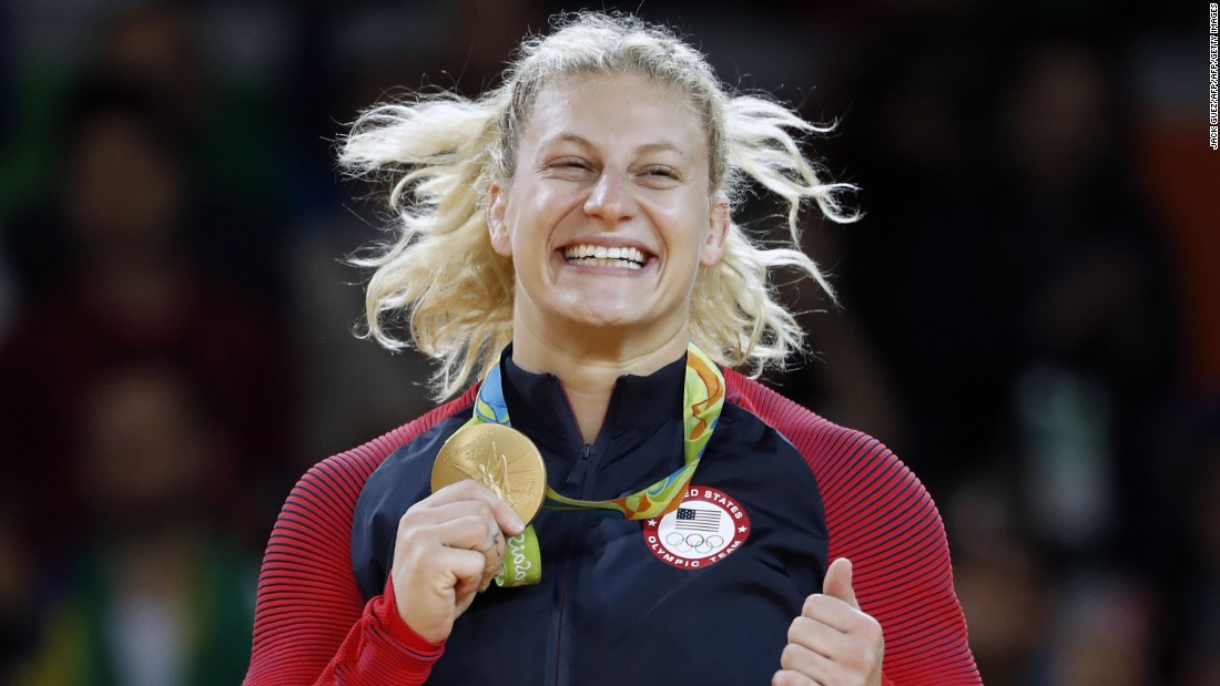 Kayla Harrison celebrates successfully defending her Olympic gold medal at last year&#39;s Rio Olympics. 