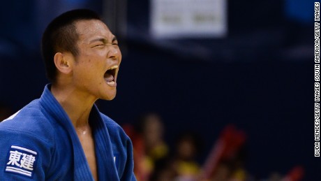 RIO DE JANEIRO, BRAZIL - AUGUST 27: Masashi Ebinuma of Japan celebrates the victory and the gold medal in the -66 kg final category during the World Judo Championships at the Maracanazinho gymnasium on August 27, 2013 in Rio de Janeiro, Brazil. (Photo by Buda Mendes/Getty Images)