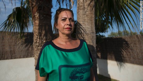 Gil, standing under a palm tree in her front yard, says she can&#39;t imagine why the suspects chose her neighborhood as their home base.