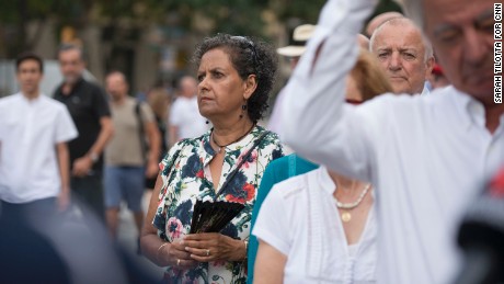Meera Andrews, center, waits in line to attend the memorial mass at Sagrada Familia cathedral on Sunday, August 20.
