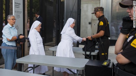 A group of nuns go through security at Sagrada Familia.