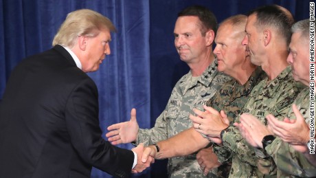 ARLINGTON, VA - AUGUST 21:  U.S. President Donald Trump greets military leaders before his speech on Afghanistan at the Fort Myer military base on August 21, 2017 in Arlington, Virginia. Trump was expected to announce a modest increase in troop levels in Afghanistan, the result of a growing concern by the Pentagon over setbacks on the battlefield for the Afghan military against Taliban and al-Qaeda forces.  (Photo by Mark Wilson/Getty Images)