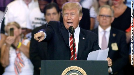 PHOENIX, AZ - AUGUST 22:  U.S. President Donald Trump speaks to supporters at the Phoenix Convention Center during a rally on August 22, 2017 in Phoenix, Arizona. An earlier statement by the president that he was considering a pardon for Joe Arpaio,, the former sheriff of Maricopa County who was convicted of criminal contempt of court for defying a court order in a case involving racial profiling, has angered Latinos and immigrant rights advocates.  (Photo by Ralph Freso/Getty Images)