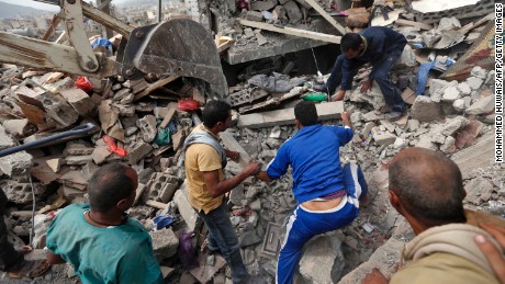 Yemenis search under the rubble of a house destroyed in Friday&#39;s airstrike. 
