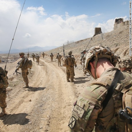 PUL-E ALAM, AFGHANISTAN - MARCH 29:  Soldiers with the U.S. Army&#39;s 2nd Battalion 87th Infantry Regiment, 3rd Brigade Combat Team, 10th Mountain Division patrol on the edge of a village outside of Forward Operating Base (FOB) Shank on March 29, 2014 near Pul-e Alam, Afghanistan. The primary mission of soldiers with the 10th Mountain Division stationed at FOB Shank is to advise and assist Afghan National Security Forces in the region. The soldiers continue to patrol outside the FOB in an effort to decrease rocket attacks on the FOB from the nearby villages.  Security is at a heightened state throughout Afghanistan as the nation prepares for the April 5th presidential election.  (Photo by Scott Olson/Getty Images)