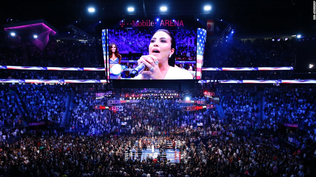 Demi Lovato sang the national anthem before the fight.