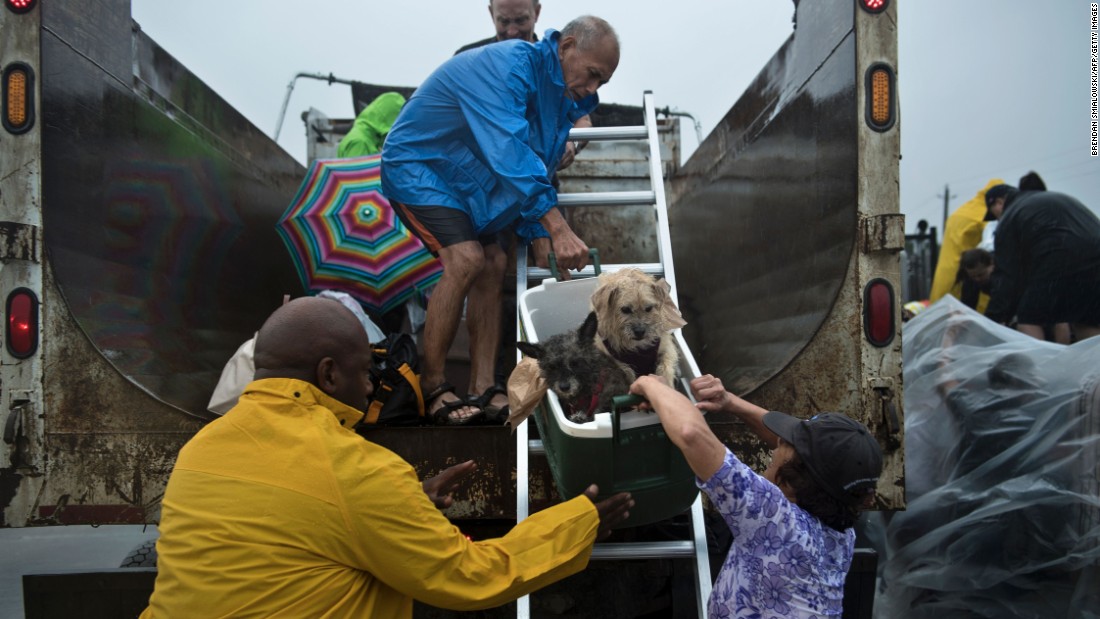 Evacuees are loaded onto a truck in Houston.