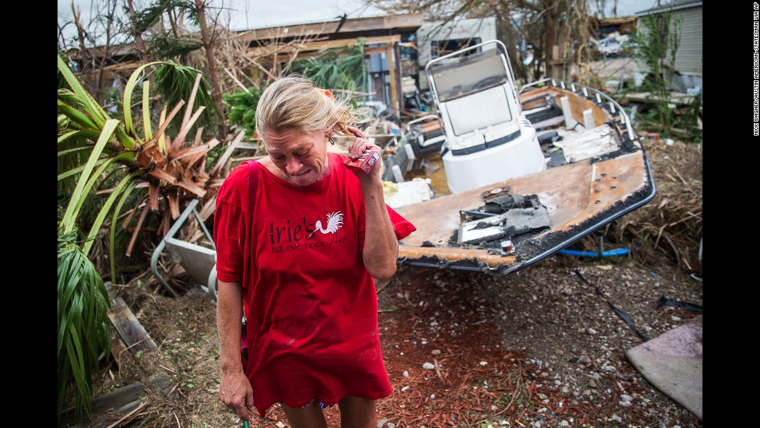 Melani Zurawski cries while inspecting her home in Port Aransas, Texas.