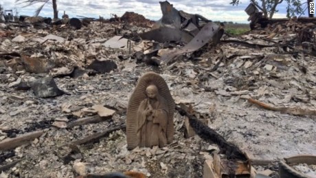 Texas woman after returning to burned home: &quot;This statue is the only thing that survived.&quot;