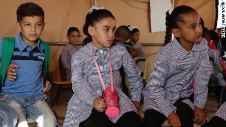 Jana Zawahra (c) attends class in a tent after her school was demolished in Jub El-Thib.