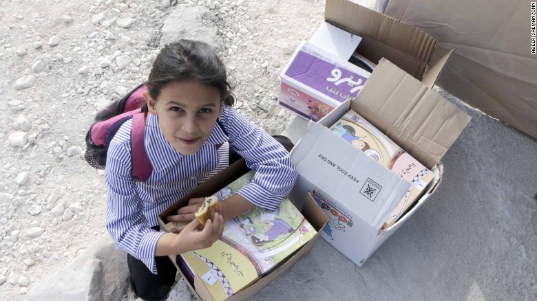 Ibtisam, a 6-year-old student, said she was excited to get her books for the new school year.