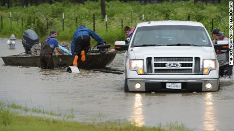 Civilian rescuers put their boat in the water on a flooded road to search for survivors in the aftermath of Hurricane Harvey in Cypress, Texas on August 29, 2017.
Hurricane Harvey has set what forecasters believe is a new rainfall record for the continental United States, officials said Tuesday. / AFP PHOTO / MANDEL NGAN        (Photo credit should read MANDEL NGAN/AFP/Getty Images)
