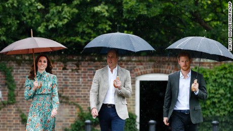 William, Harry and Catherine arrive at the White Garden at Kensington Palace, Princess Diana&#39;s home for 15 years, in London on Wednesday. The garden was planted to mark 20 years since her death. 