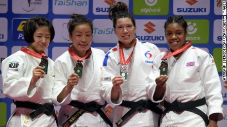Japan&#39;s Tsukasa Yoshida, Mongolia&#39;s Sumiya Dorjsuren, France&#39;s Helene Receveaux and Great Britain&#39;s Nekoda Smythe-Davis show off their medals in the women&#39;s -57kg division. 