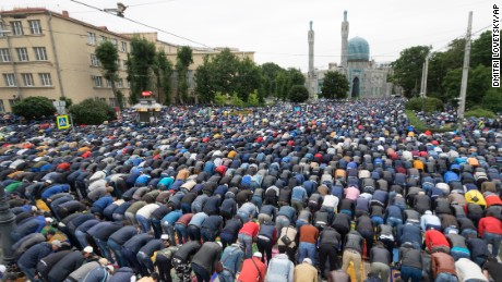 Muslims pray outside a mosque in St. Petersburg, Russia on Friday.