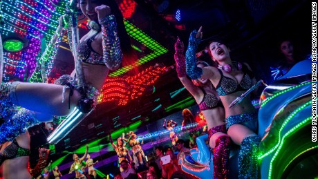 TOKYO, JAPAN - JUNE 29: Dancers dressed as futuristic characters perform during a show at The Robot Restaurant on June 29, 2014 in Tokyo, Japan. The now famous Robot Restaurant opened two years ago in Kabukicho area of Shinjuku at an estimated cost of 10 million U.S. dollars.  Performances are held three times a day and cater mostly to foreign tourists. The cabaret style shows include bikini clad futuristic dancers, performers dressed as robots and a host of large scale robots and vehicles controlled with remotes by stage hands dressed as Ninjas  (Photo by Chris McGrath/Getty Images)