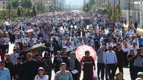Local residents walk to attend a mass protest in Chechnya&#39;s provincial capital Grozny, Russia, Monday, Sept. 4, 2017. Tens of thousands of people have taken to the streets in Russia&#39;s predominantly Muslim Chechnya to protest what the Chechen leader called &quot;genocide of Muslims&quot; in Myanmar. (AP Photo/Musa Sadulayev)