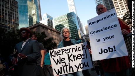 Activists rally in support of Colin Kaepernick outside the NFL offices on August 23, 2017