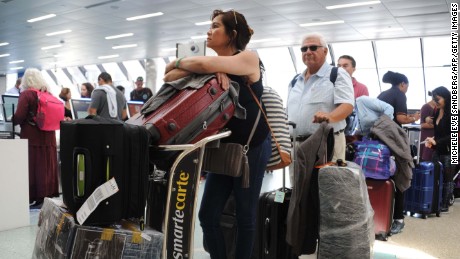 People flock to Fort Lauderdale International Airport on Thursday for evacuations out of Florida.