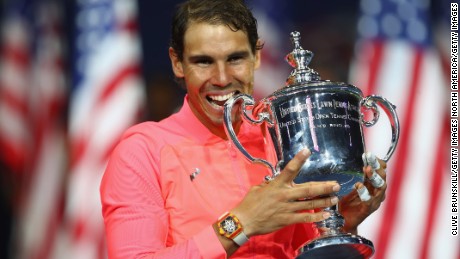 NEW YORK, NY - SEPTEMBER 10:  Rafael Nadal of Spain bites the championship trophy during the trophy ceremony after their Men&#39;s Singles Finals match on Day Fourteen of the 2017 US Open at the USTA Billie Jean King National Tennis Center on September 10, 2017 in the Flushing neighborhood of the Queens borough of New York City. Rafael Nadal defeated Kevin Anderson in the third set with a score of 6-3, 6-3, 6-4.  (Photo by Clive Brunskill/Getty Images)