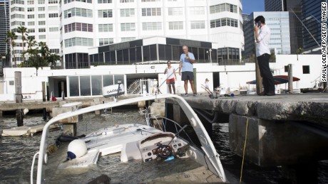 Partially submerged boats caused by Hurricane Irma sit in the water in a marina in downtown Miami, Florida, September 11, 2017. / AFP PHOTO / SAUL LOEB        (Photo credit should read SAUL LOEB/AFP/Getty Images)